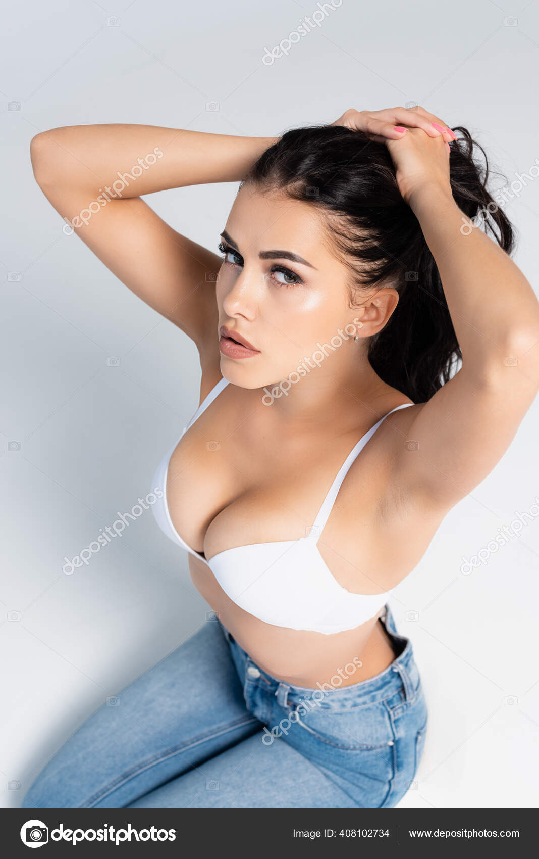 Sexy Woman Closed Eyes Jeans Bra Sitting Chair Isolated Grey