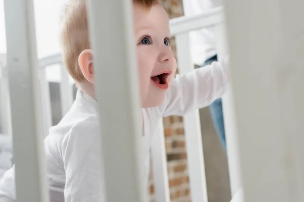 Selective Focus Excited Infant Boy Open Mouth Crib — Stock Photo, Image