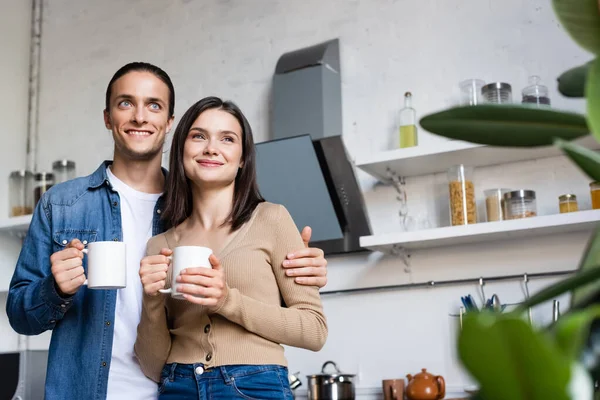 Selective Focus Joyful Couple Looking Away While Holding Cups Coffee — Stock Photo, Image