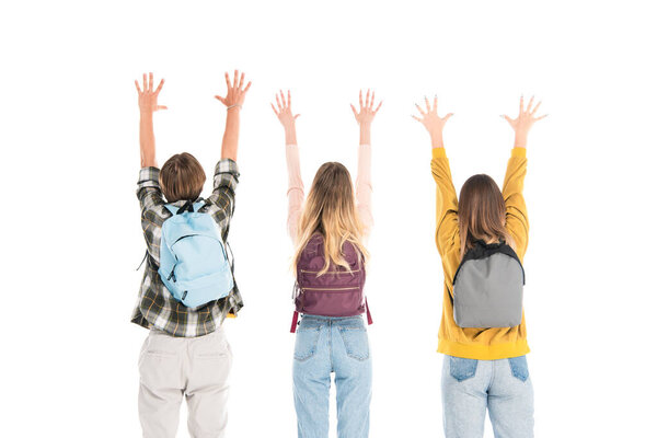 Back view of teenagers with backpacks and raised hands isolated on white