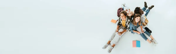 Panoramic Shot Smiling Multicultural Teenagers Smiling While Writing Notebooks Grey — Stock Photo, Image