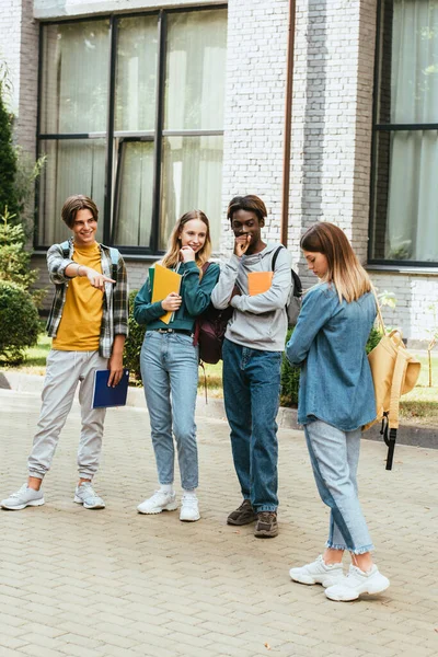 Smiling Multiethnic Teenagers Pointing Finger Sad Girl Outdoors — Stock Photo, Image