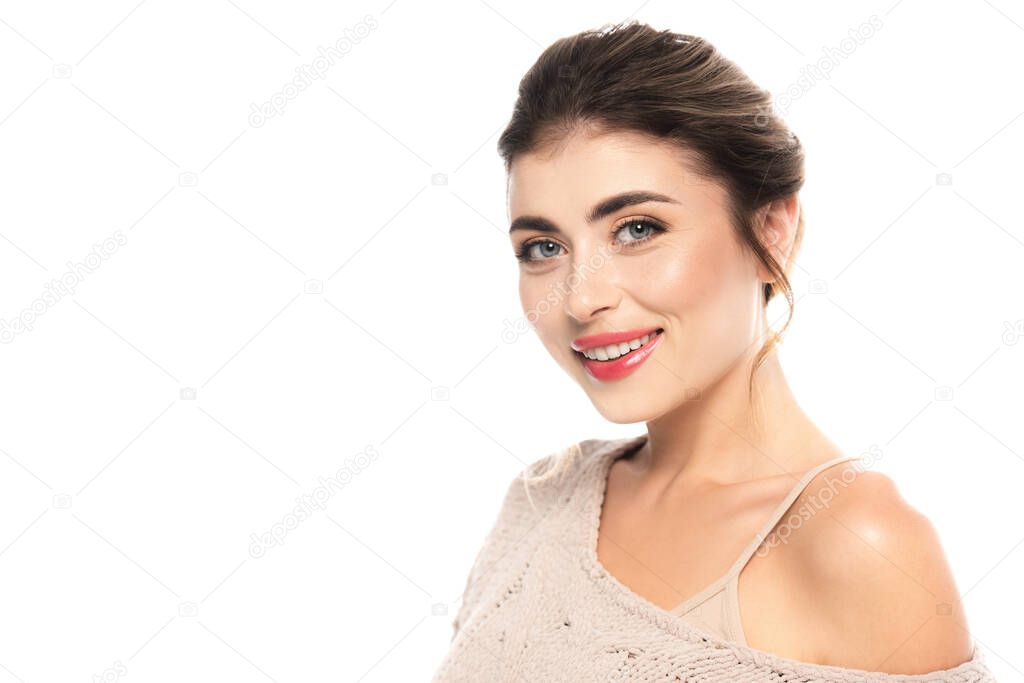 joyful woman in openwork sweater looking at camera isolated on white