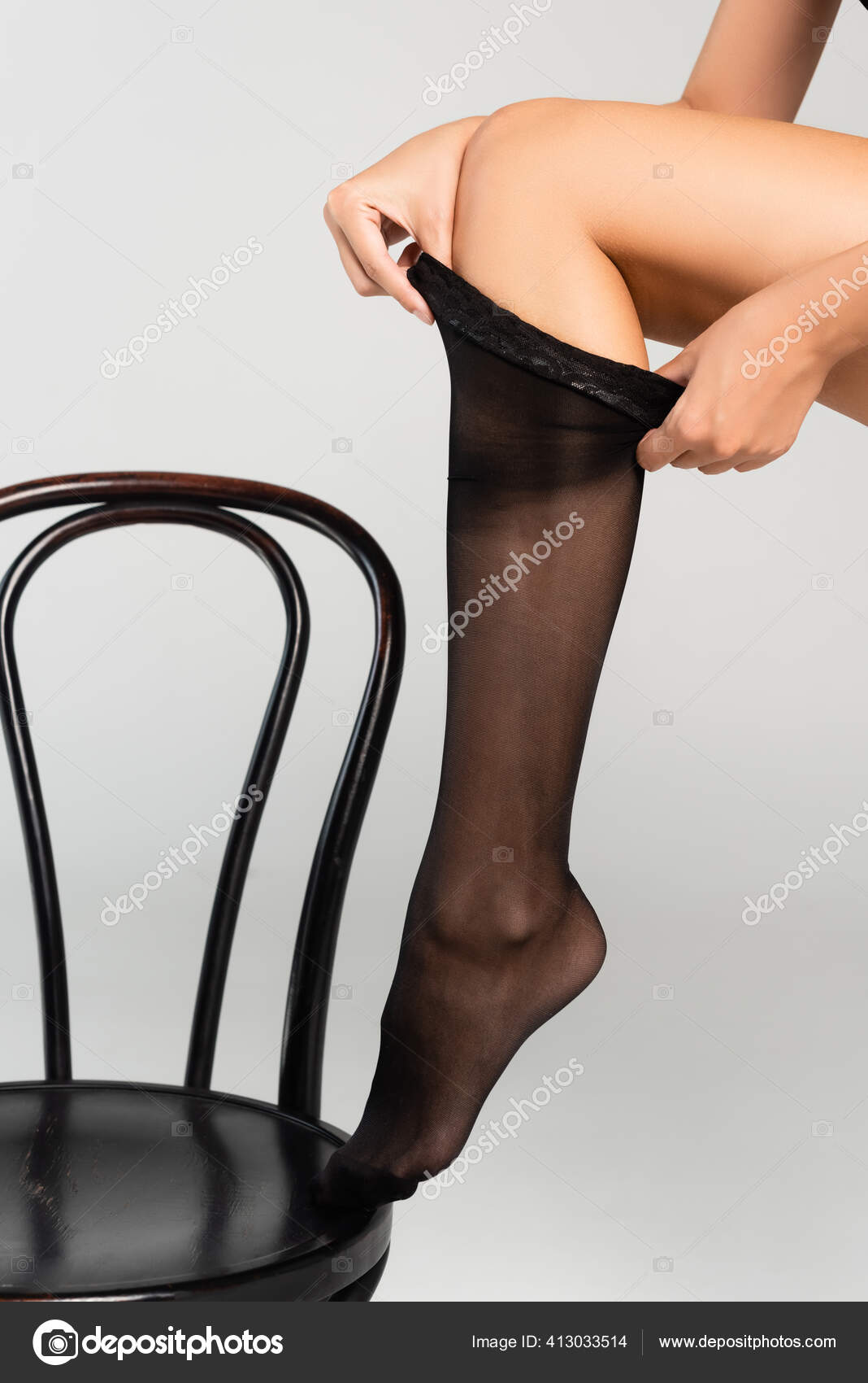 Cropped View Woman Putting Stocking While Leaning Black Chair Grey Stock Photo Image By C Igorvetushko 413033514
