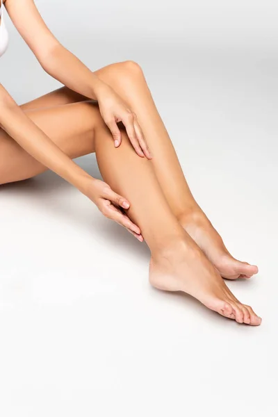 Cropped View Woman Touching Smooth Leg Grey While Sitting Grey — Stock Photo, Image