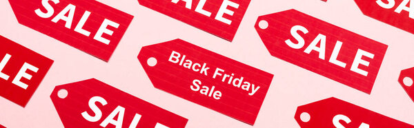 website header of labels with sale and black friday lettering on pink