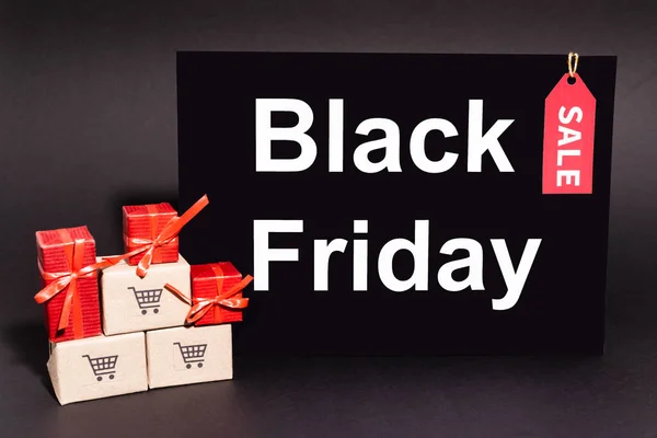 Gifts Small Carton Boxes Placard Black Friday Lettering Dark Background — Stock Photo, Image