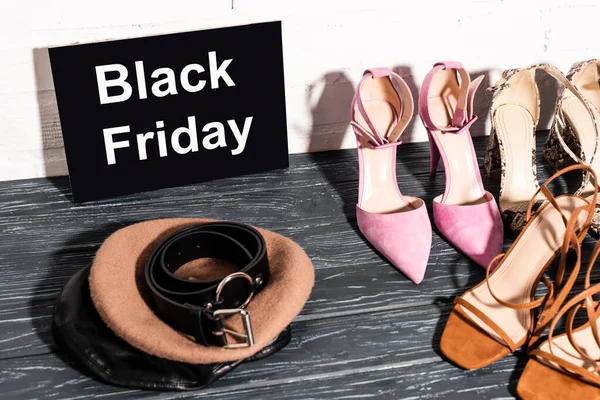 Trendy Shoes Board Black Friday Lettering Beret Belt Wooden Surface — Stock Photo, Image