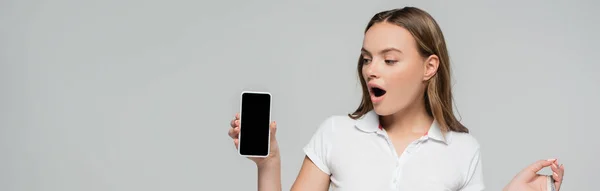 Panoramic Concept Shocked Woman Looking Smartphone Blank Screen Isolated Grey — Stock Photo, Image