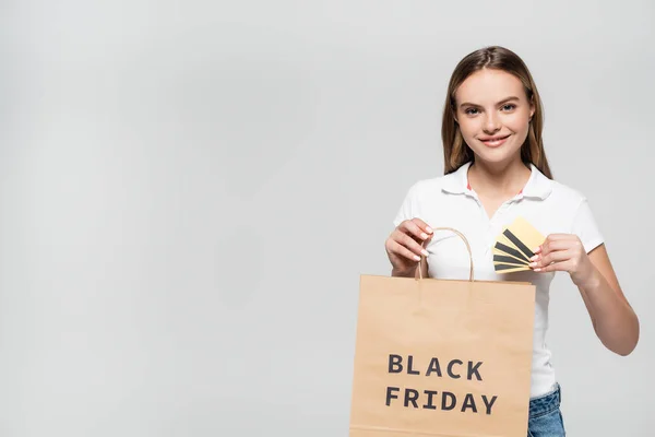 Young Joyful Woman Holding Credit Cards Looking Shopping Bag Black — Stock Photo, Image