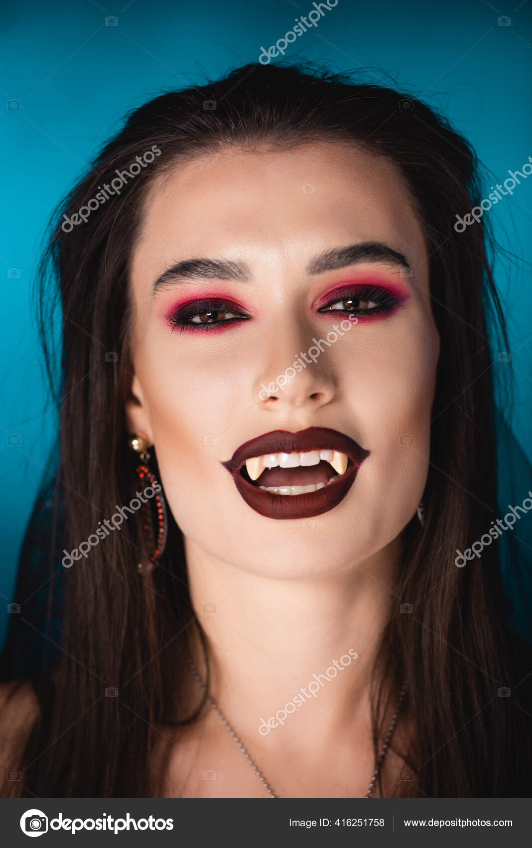 Brunette Vampire Black Makeup White Scary Teeth Blue Stock Photo by  ©IgorVetushko 416251758