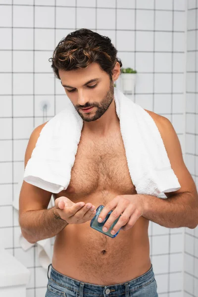 Shirtless Man Towel Pouring Shaving Lotion Bathroom — Stock Photo, Image