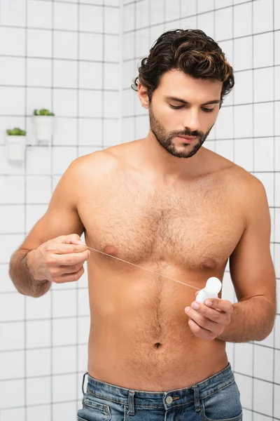Muscular Man Holding Dental Floss Bathroom — Stock Photo, Image