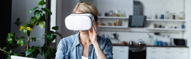 blonde woman wearing vr headset, horizontal banner