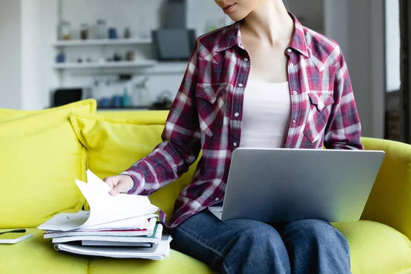 Cropped View Woman Checkered Shirt Holding Laptop Looking Documents — Stock Photo, Image