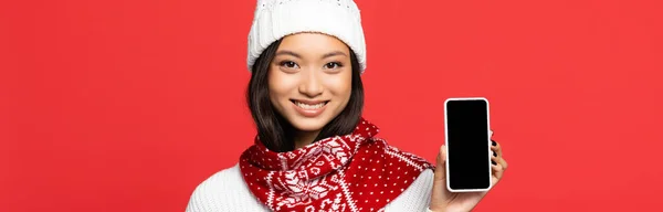 Happy Asian Woman Hat Scarf Holding Smartphone Blank Screen Isolated — Stock Photo, Image