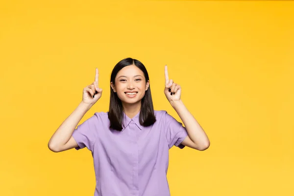 Happy Asian Woman Pointing Fingers Isolated Yellow — Stock Photo, Image