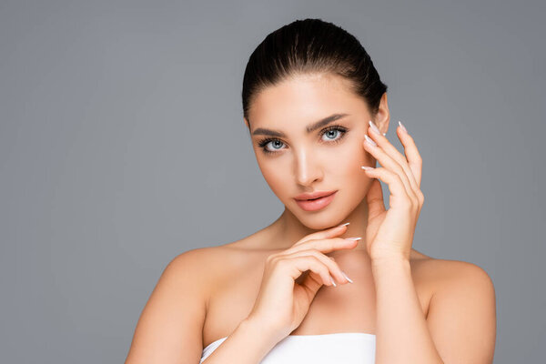 beautiful woman posing isolated on grey