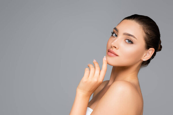 beautiful woman posing isolated on grey