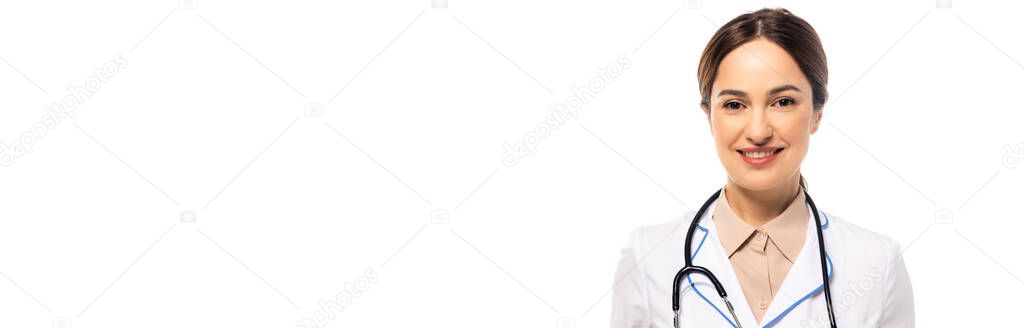 Panoramic shot of doctor with stethoscope smiling at camera isolated on white