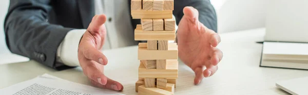 Cropped View Businessman Hands Blocks Wood Tower Game Sitting Desk — Stock Photo, Image