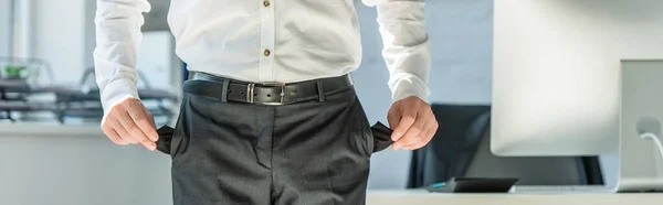 Cropped View Businessman Showing Empty Pockets While Standing Desk Office — Stock Photo, Image