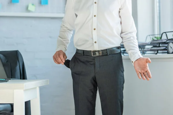 Cropped View Businessman Gesturing Showing Empty Pocket While Standing Workplace — Stock Photo, Image