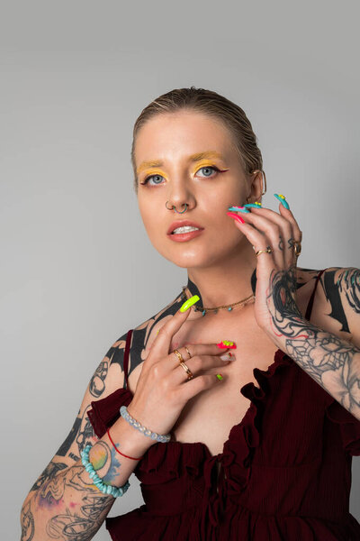 A young, stunning woman charms with her unique style and bold accessories.