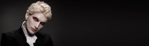 A young man impresses with a remarkable Halloween costume, blending elegance and fantasy.