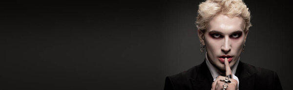 A handsome young man showcases an epic Halloween outfit, embracing the festive spirit.