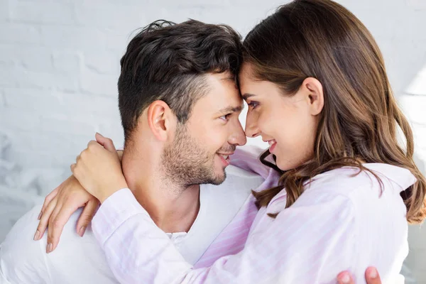 Beautiful happy couple on lovers embracing together — Stock Photo