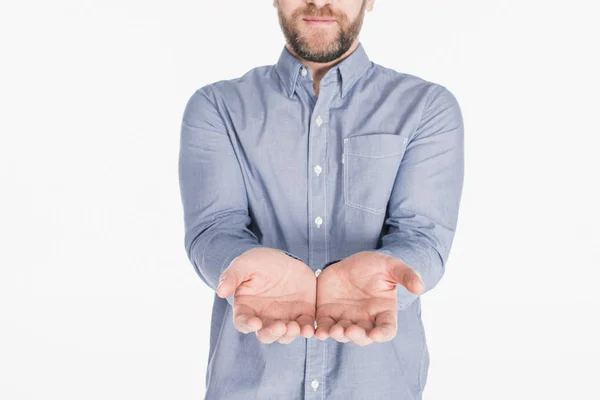 Partial view of man with outstretched hands isolated on white — Stock Photo