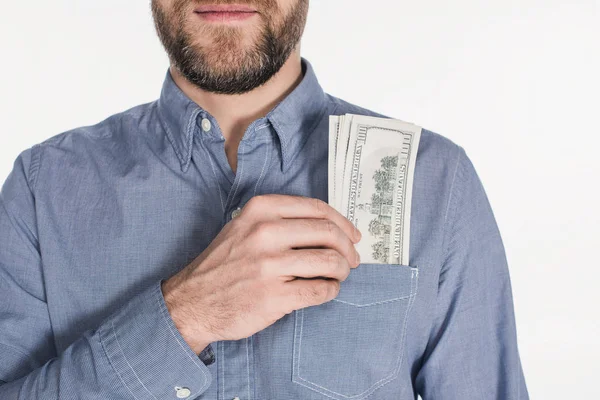 Vue partielle de l'homme barbu avec des billets en dollars dans une poche isolée sur blanc — Photo de stock