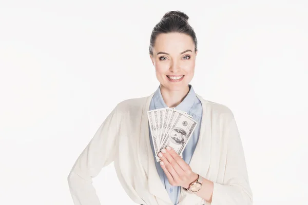 Retrato de mulher sorridente segurando notas de dólar na mão isolado em branco — Fotografia de Stock