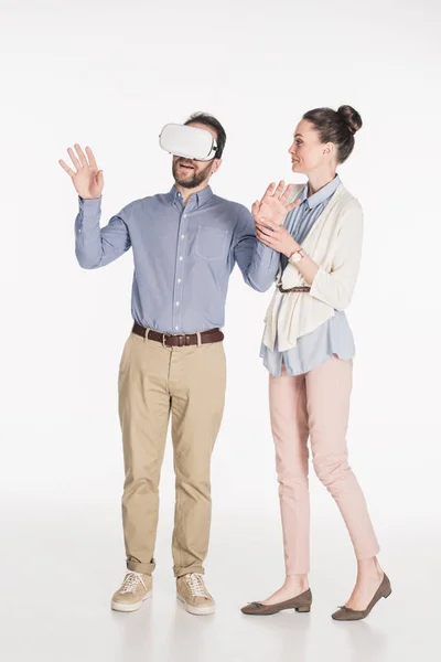 Man in virtual reality headset with wife near by isolated on white — Stock Photo