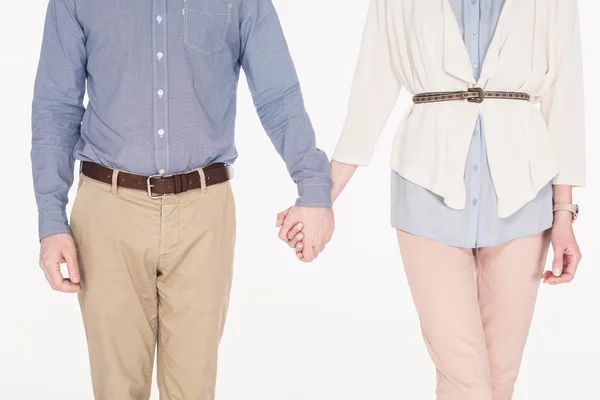 Cropped shot of wife and husband holding hands together isolated on white — Stock Photo