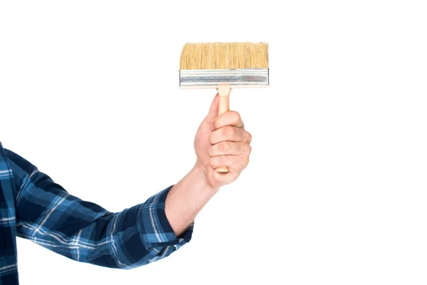 Cropped shot of man holding paint brush isolated on white background — Stock Photo