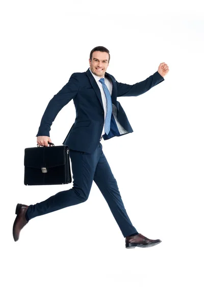 Бізнесмен з портфелем стрибає і посміхається на камеру ізольовано на білому — стокове фото