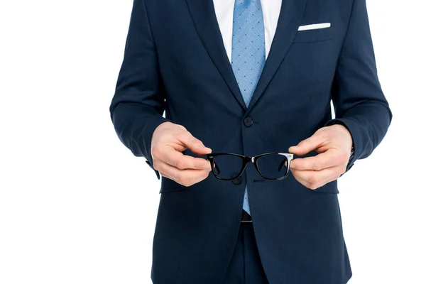 Cropped shot of businessman in formal wear holding eyeglasses isolated on white — Stock Photo