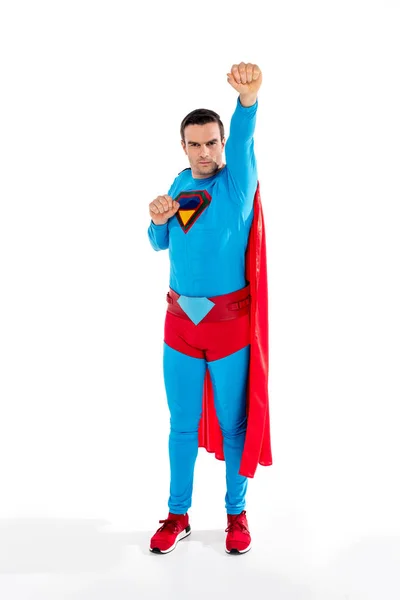 Full length view of handsome male superhero raising hand and looking at camera on white — Stock Photo