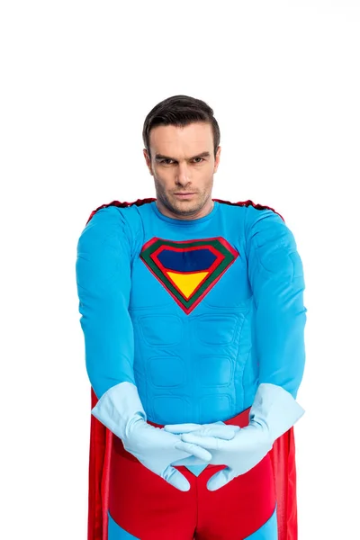 Handsome superhero in rubber gloves looking at camera isolated on white — Stock Photo