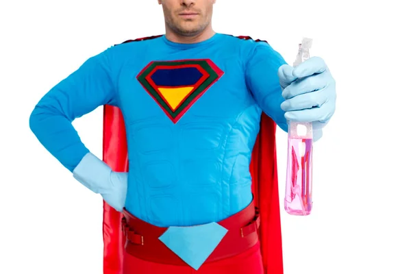 Cropped shot of male superhero in rubber gloves holding spray bottle with detergent isolated on white — Stock Photo