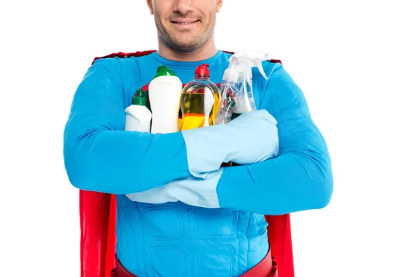 Tiro recortado de super-herói sorrindo segurando suprimentos de limpeza isolados em branco — Fotografia de Stock