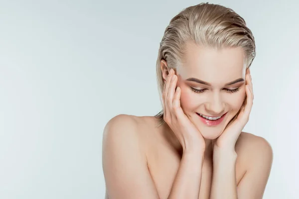 Portrait of happy blonde girl, isolated on grey — Stock Photo