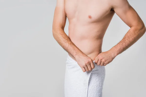 Partial view of man in white towel isolated on grey — Stock Photo