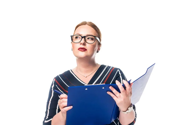 Pensive businesswoman in eyeglasses writing in clipboard isolated on white background — Stock Photo