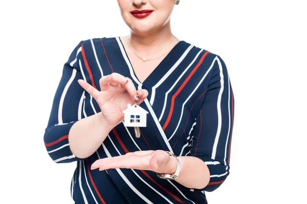 Cropped image of female realtor presenting keys from house isolated on white background — Stock Photo