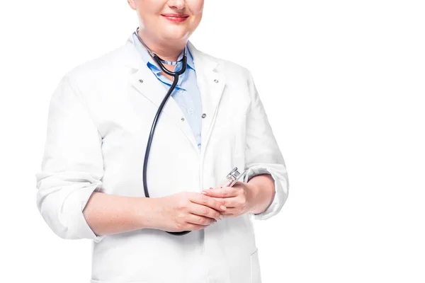 Cropped image of female doctor in white coat with stethoscope isolated on white background — Stock Photo