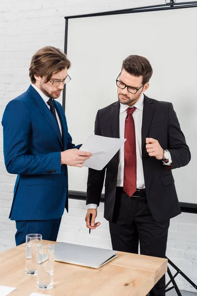 Businessmen working with documents together at conference room — Stock Photo