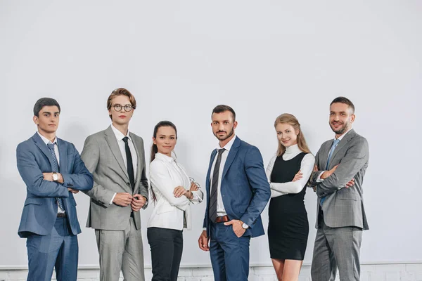 Businesspeople posing near board after training in hub — Stock Photo